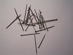A group of small brass pins